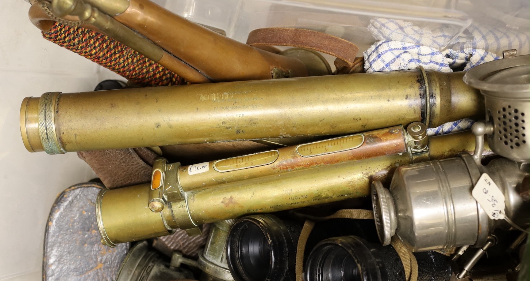 Various binoculars, a bugle, Stanley dumpy level, etc.